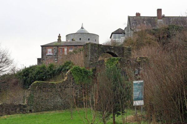 Butter Gate medieval monument in Drogheda surrounded by overgrown vegetation