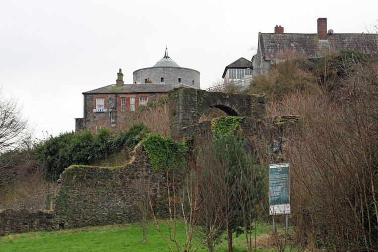 Butter Gate medieval monument in Drogheda surrounded by overgrown vegetation