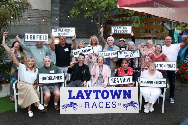 Laytown residents holding estate signs at the Pride of Place draw for Laytown Races 2026
