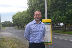 Cllr Stephen McKee beside a bus stop in Donacarney, East Meath.