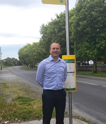 Cllr Stephen McKee beside a bus stop in Donacarney, East Meath.