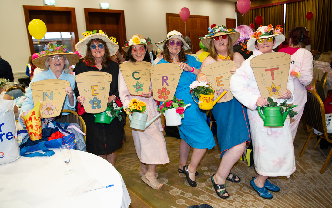Women dressed in colourful outfits at a Northeast Dip in the Nip fundraising event