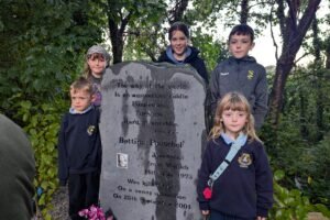 Children gathered beside the memorial to Bettina Poeschel in Donore