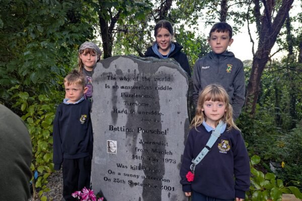 Children gathered beside the memorial to Bettina Poeschel in Donore