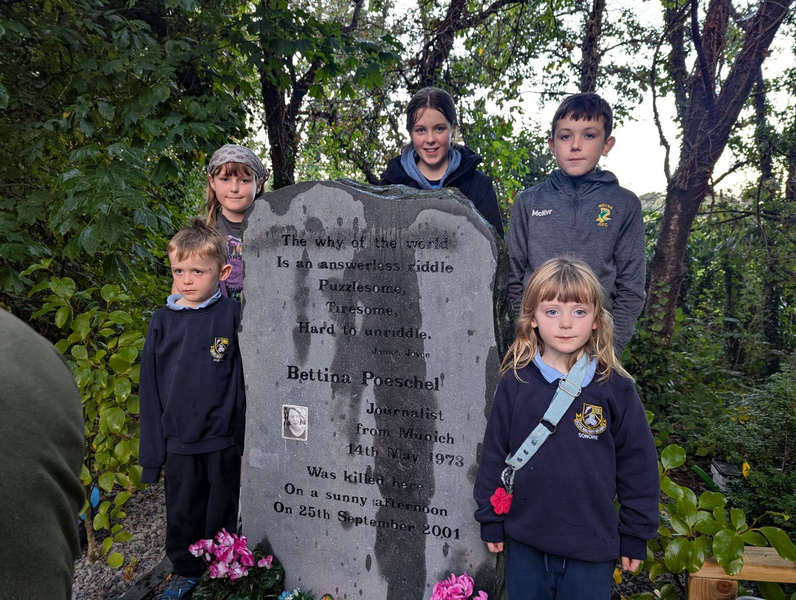 Children gathered beside the memorial to Bettina Poeschel in Donore