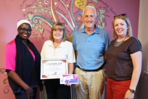 Paula Doyle receiving a Drogheda Tidy Towns community award in Moneymore