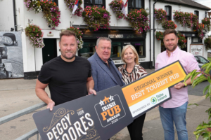 Peggy Moore’s team outside the Drogheda pub with their Best Tourist Pub regional award