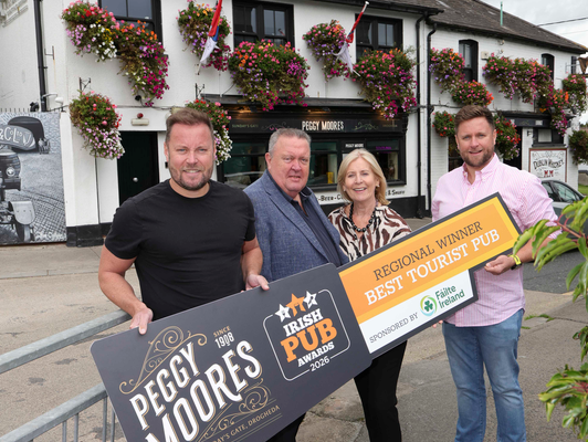 Peggy Moore’s team outside the Drogheda pub with their Best Tourist Pub regional award