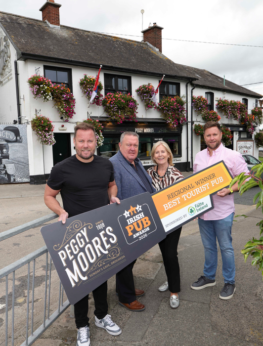 Peggy Moore’s team outside the Drogheda pub with their Best Tourist Pub regional award