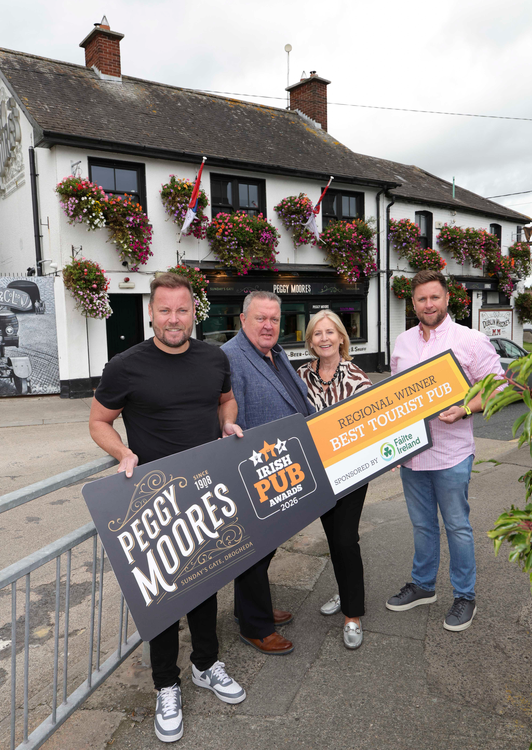 Peggy Moore’s team outside the Drogheda pub with their Best Tourist Pub regional award