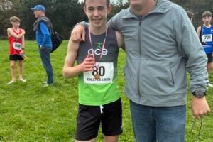 Taylor Gregory of Ace AC pictured with coach Ian O’Reilly after the Louth Cross Country Championships