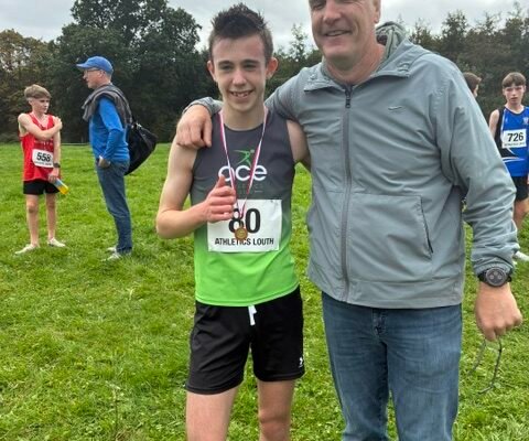Taylor Gregory of Ace AC pictured with coach Ian O’Reilly after the Louth Cross Country Championships