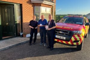 Meath County Council firefighters carrying out a home fire safety visit in Nobber during Fire Safety Week