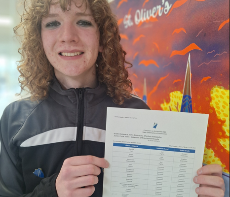Ruairí Heeney of St Oliver’s Community College in Drogheda holding his Junior Cycle results after achieving Distinctions in all nine subjects