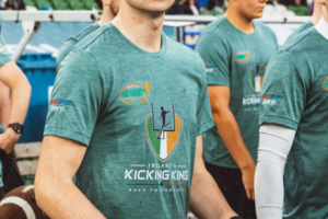 Tiernan Markey holding an American football during Ireland’s Kicking King event at Aviva Stadium