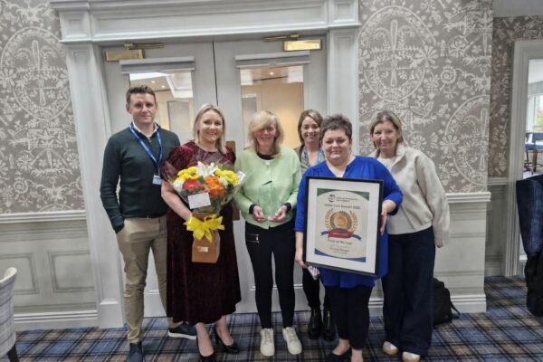 Grace Keogh holding her Carer of the Year award at the 2026 Home and Community Care Ireland Awards