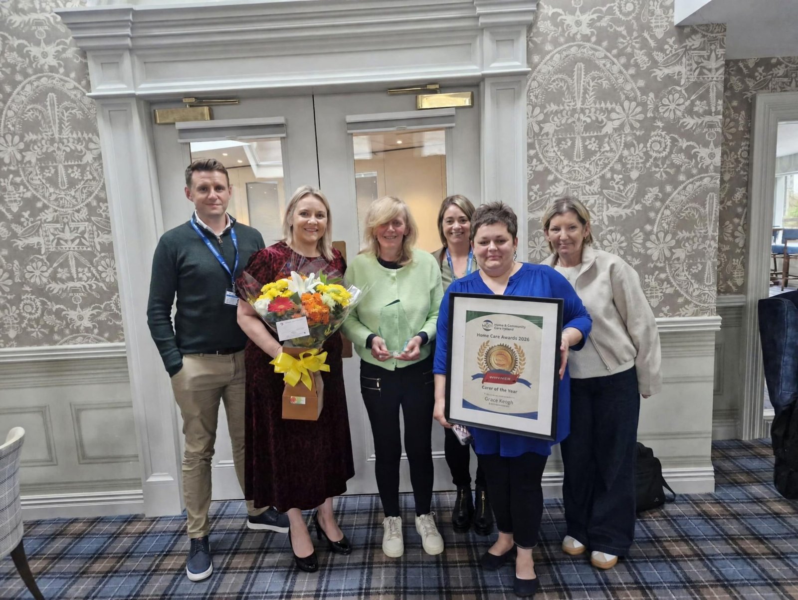 Grace Keogh holding her Carer of the Year award at the 2026 Home and Community Care Ireland Awards